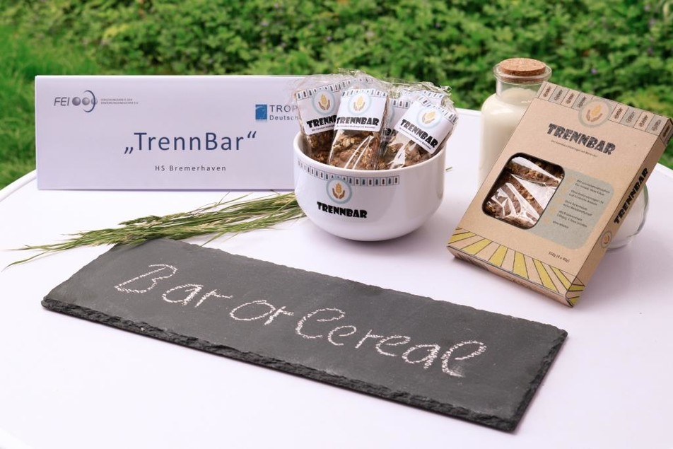 "TrennBar" ist Müsli und Müsliriegel in einem, hergestellt aus Biertreber, einem Reststoff aus der Bierherstellung. Für die Glasur wird der Treber fermentiert und erhält so ein kakaoähnliches Aroma.